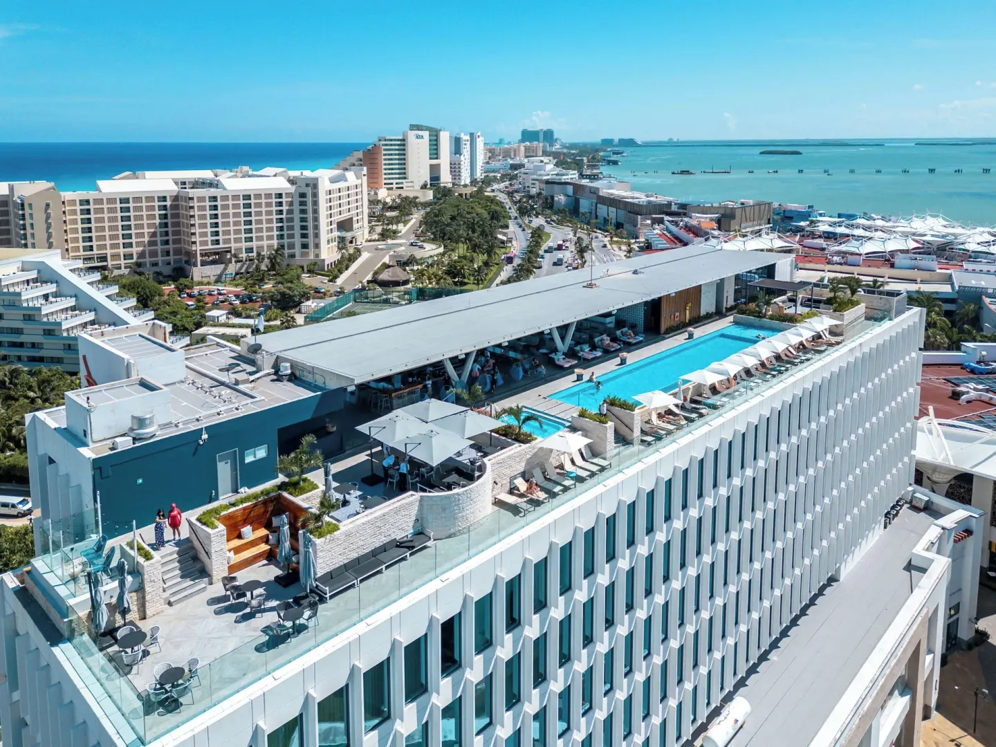 Aerial view of the rooftop pool deck at Canopy by Hilton Cancun La Isla.