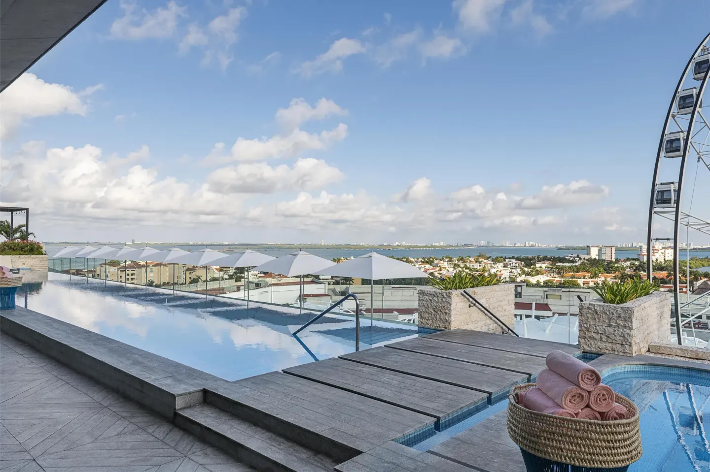 Rooftop infinity pool and city view at Canopy by Hilton Cancun La Isla.