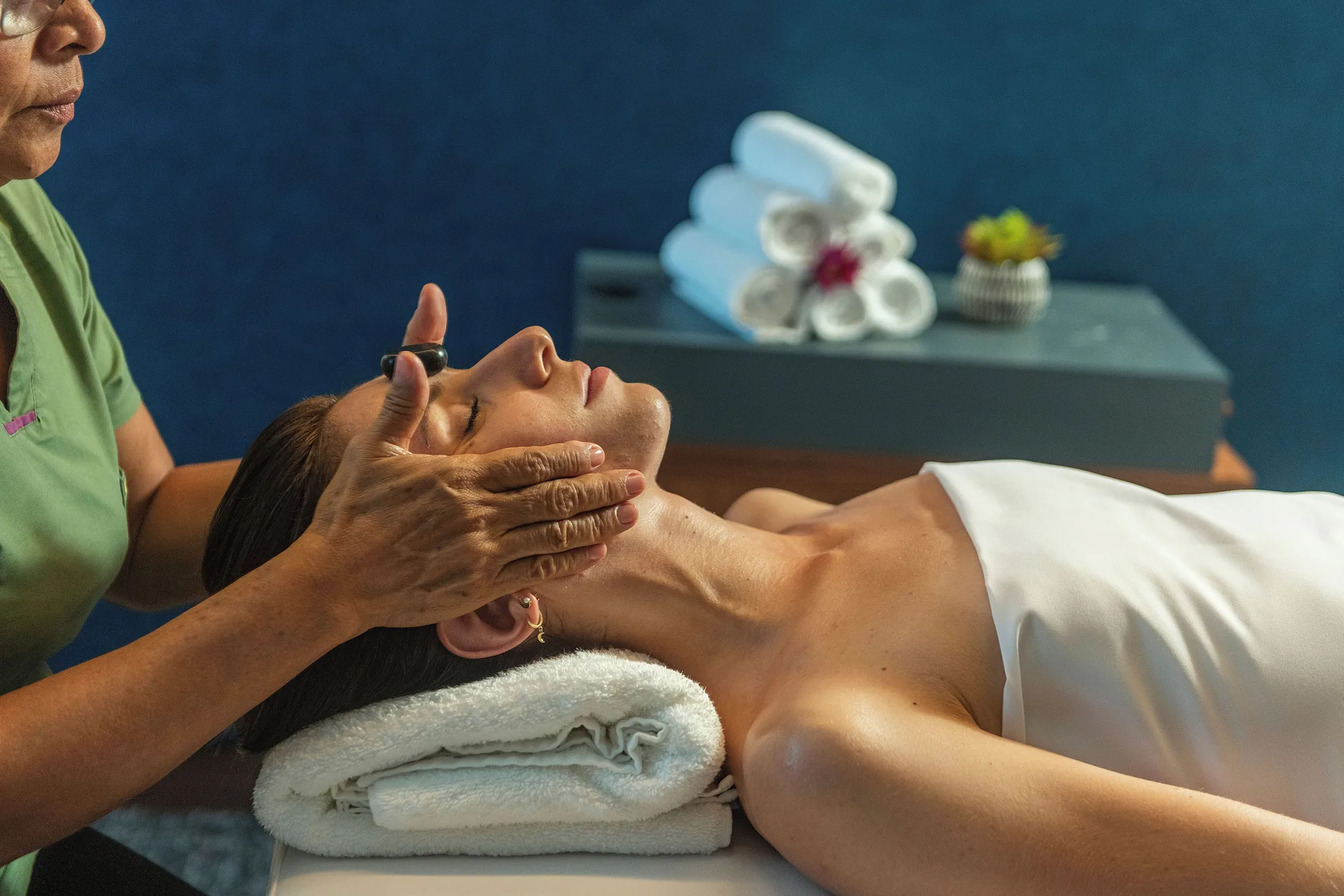 Facial massage treatment in the spa at Canopy by Hilton Cancun La Isla.