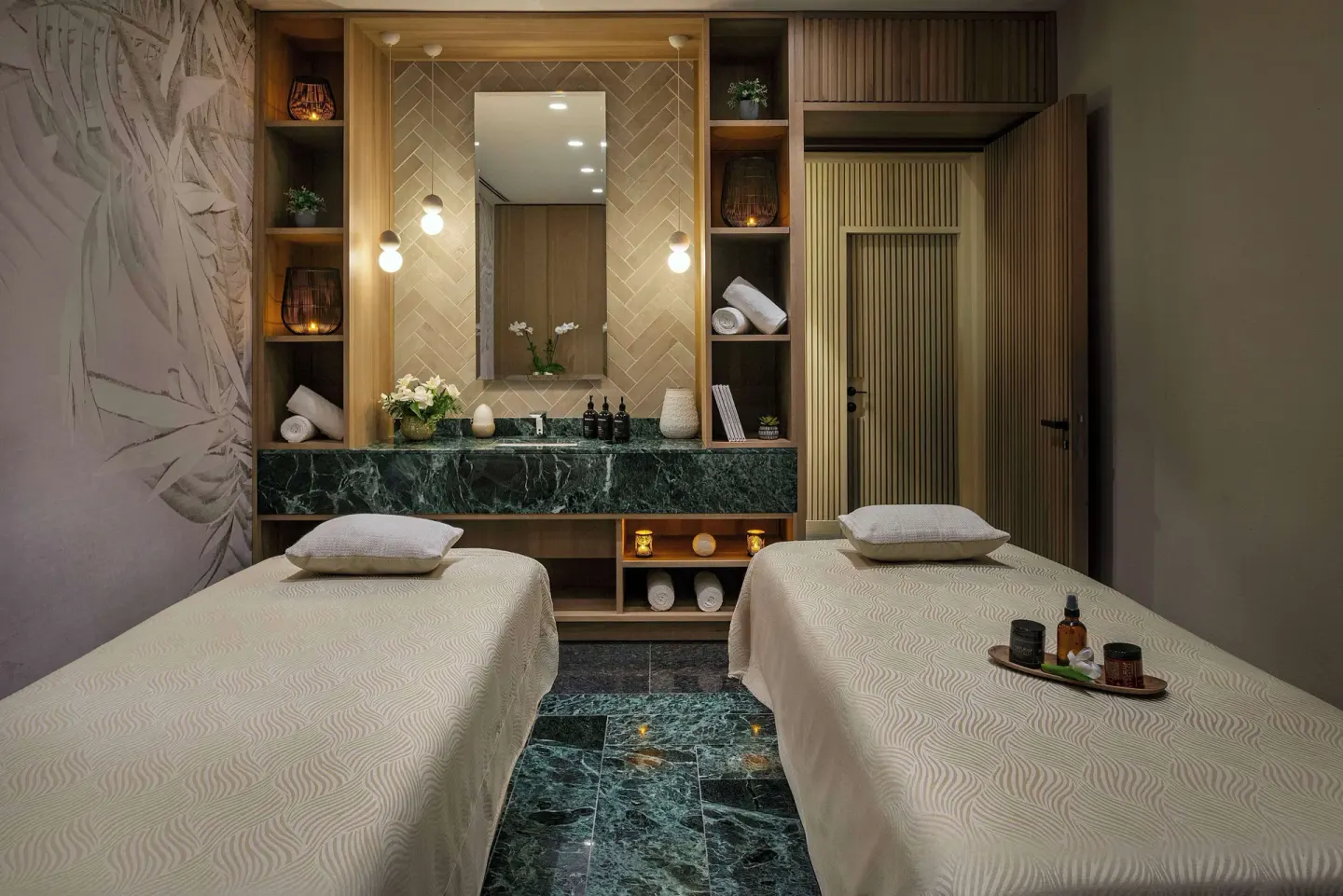 Twin spa treatment room with two massage tables at Canopy by Hilton Cancun La Isla.