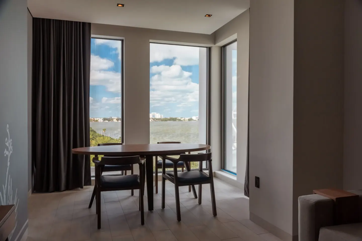 Junior Suite dining nook with panoramic lagoon view at Canopy by Hilton Cancun La Isla.