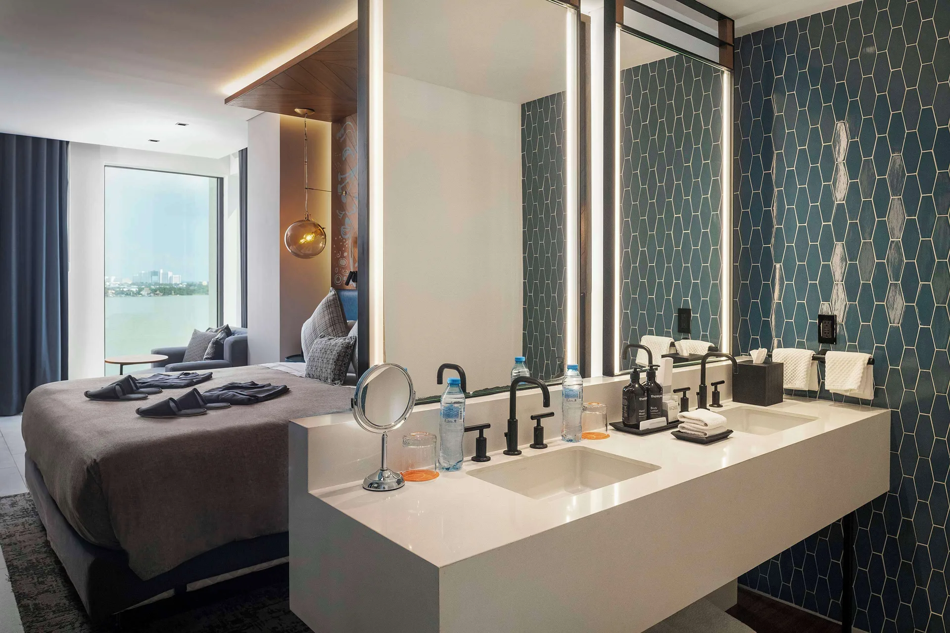 Presidential Suite king bed and vanity at Canopy by Hilton Cancun La Isla.