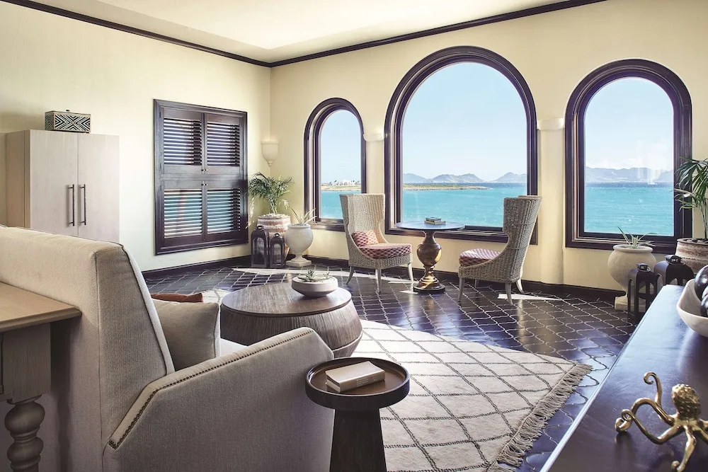Lounge area with arched windows overlooking the sea at Cap Juluca, Anguilla.