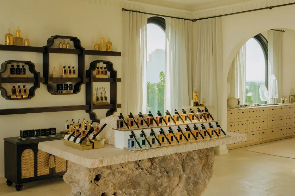 Spa retail shelves and a stone display table with bottled amenities at Cap Juluca, Anguilla.