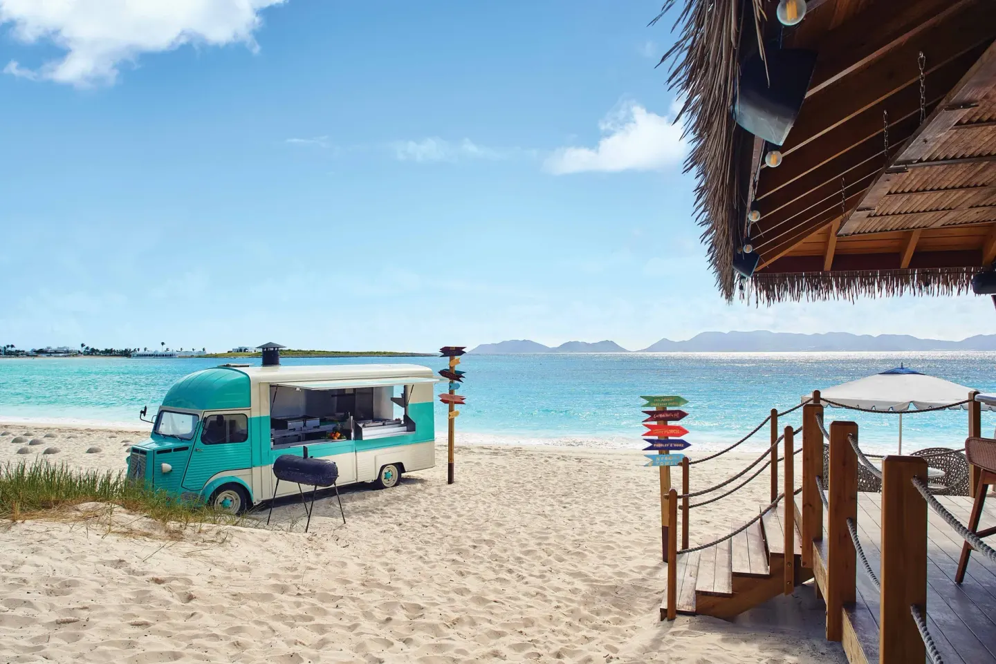 Beach food truck and deck beside turquoise water at Cap Juluca, Anguilla.