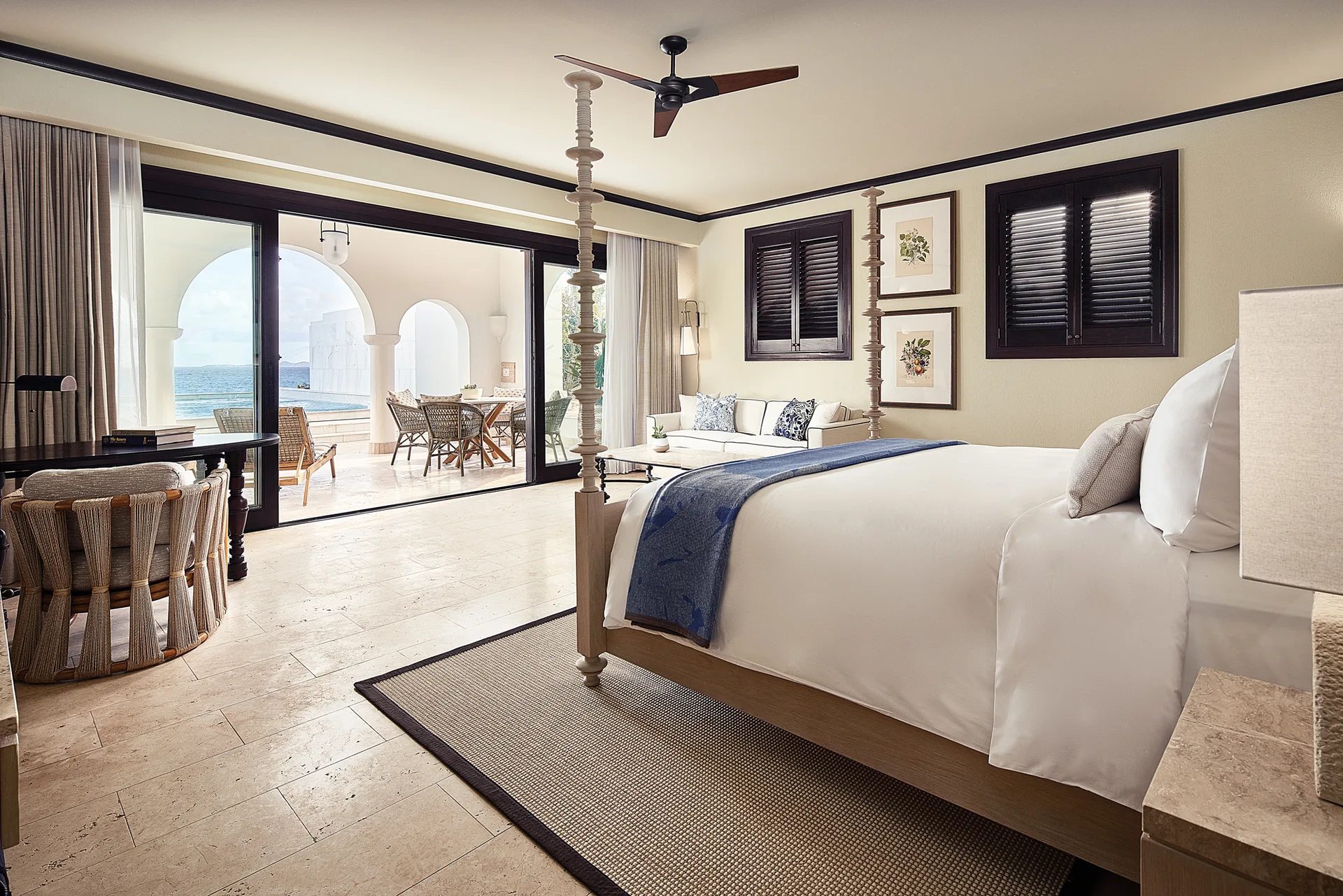 Beachfront Junior Suite king bed and terrace facing the sea at Cap Juluca, Anguilla.