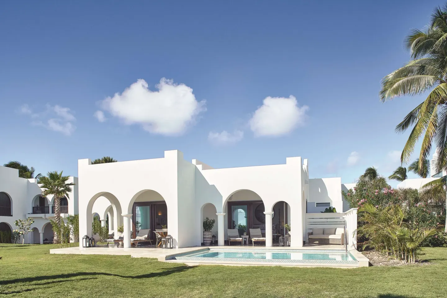 Exterior of a beachfront plunge pool casita suite at Cap Juluca, Anguilla, with private pool and arches.
