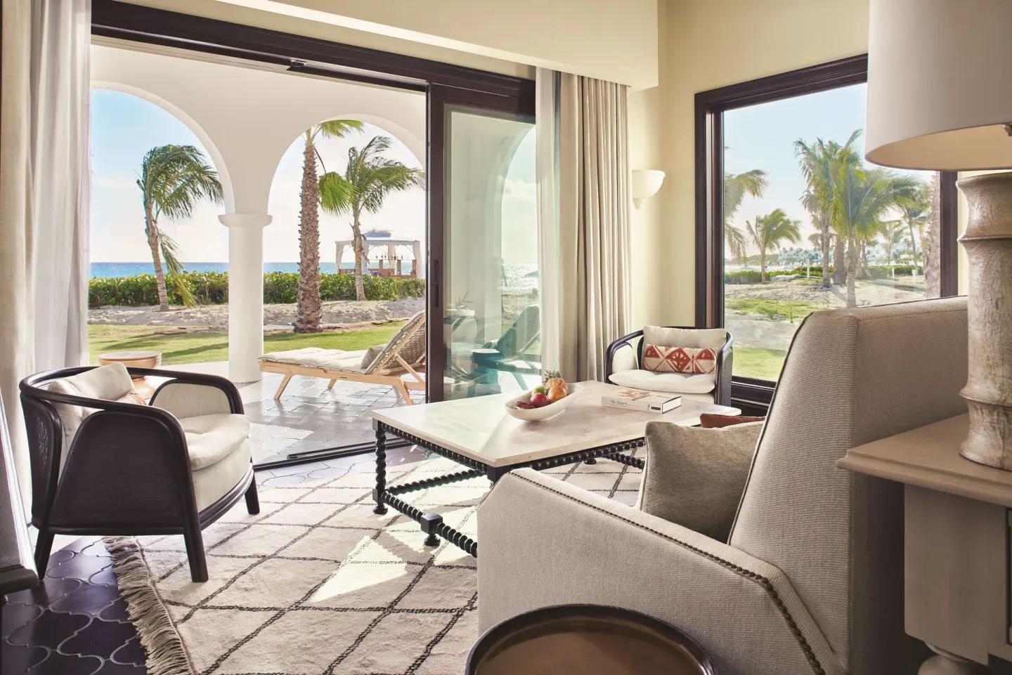 Living area of a beachfront plunge pool casita suite at Cap Juluca, Anguilla, with patio and ocean view.