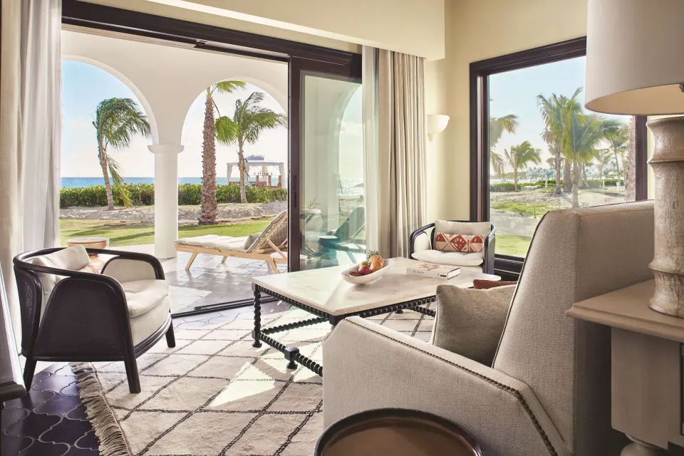 Living area of a beachfront plunge pool casita suite at Cap Juluca, Anguilla, with patio and ocean view.