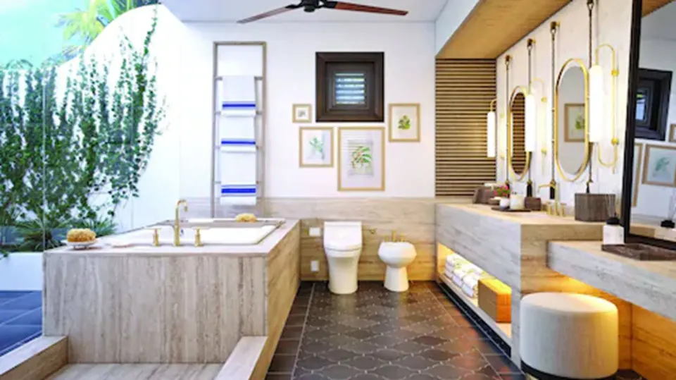 Open marble bathroom in a Deluxe Room, Beachfront at Cap Juluca, Anguilla, with tub and double vanity.