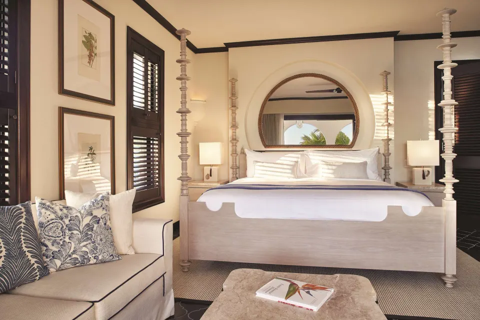 Deluxe Room Beachfront king bed and sofa at Cap Juluca, Anguilla.