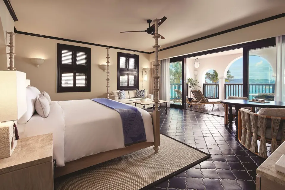 Deluxe Room Beachfront king bed with terrace view at Cap Juluca, Anguilla.