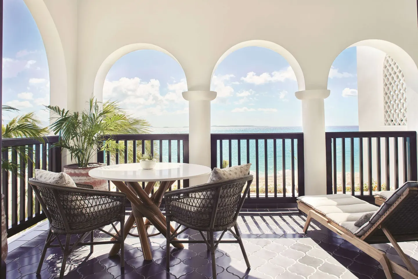 Beachfront terrace seating for a Deluxe Room at Cap Juluca, Anguilla.