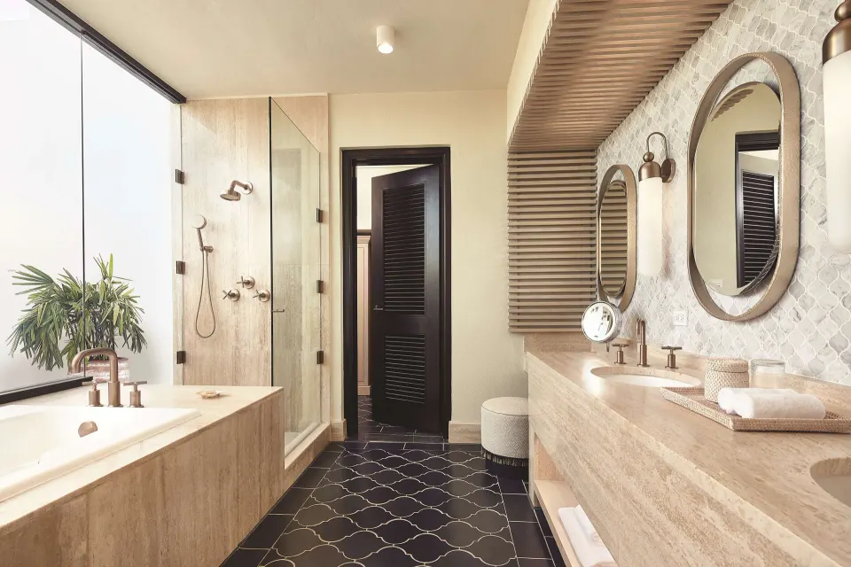 Premium Room Beachfront bathroom with tub, shower and long vanity at Cap Juluca, Anguilla.