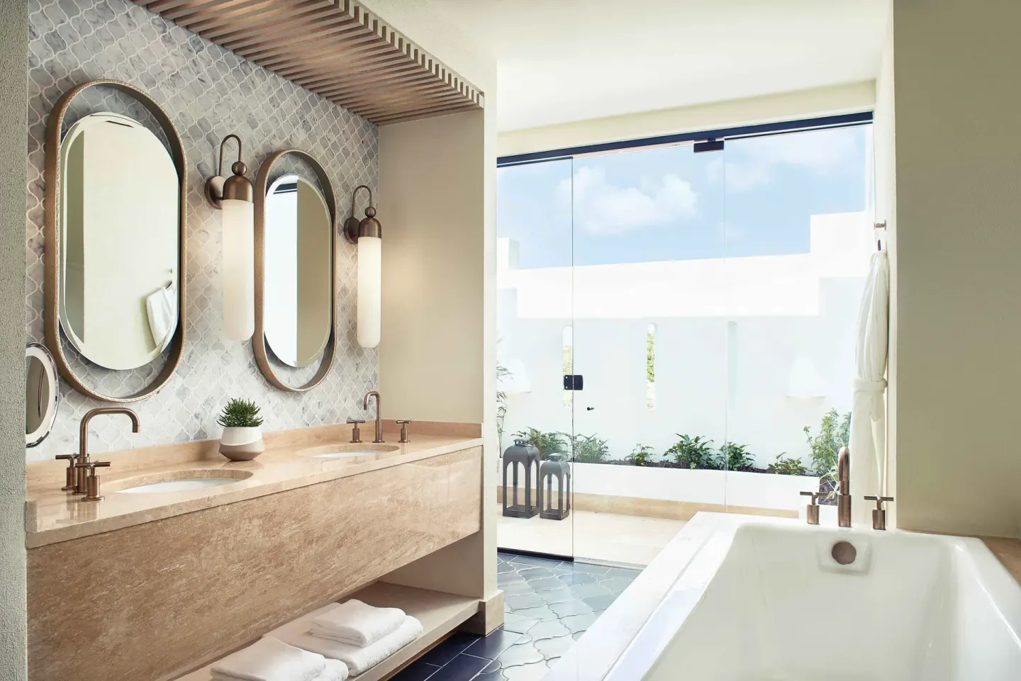 Premium Room Beachfront bathroom with twin vanity and tub at Cap Juluca, Anguilla.