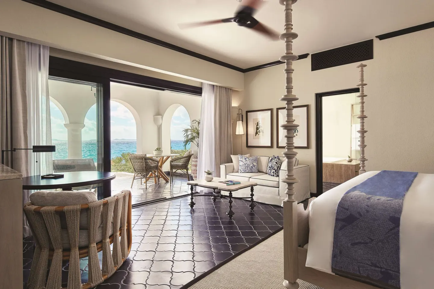 Premium Room Beachfront king bed with sitting area and sea view at Cap Juluca, Anguilla.
