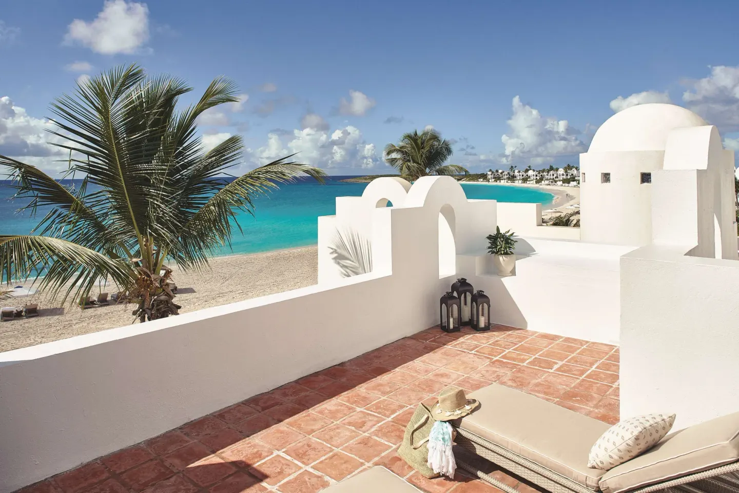 Premium Room Beachfront terrace overlooking beach and turquoise water at Cap Juluca, Anguilla.