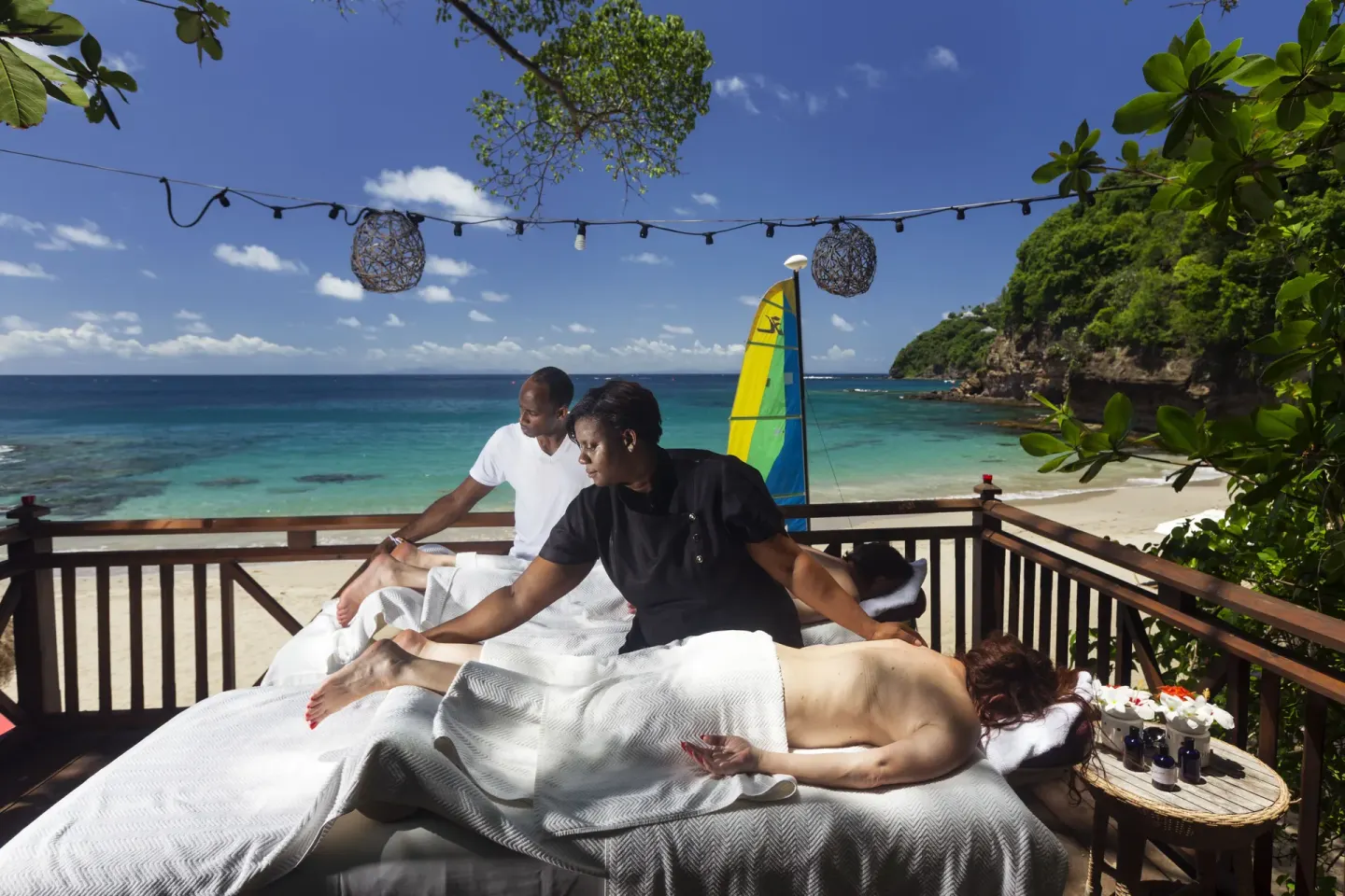 Beachfront massage treatment deck overlooking the sea at Cap Maison Resort & Spa.