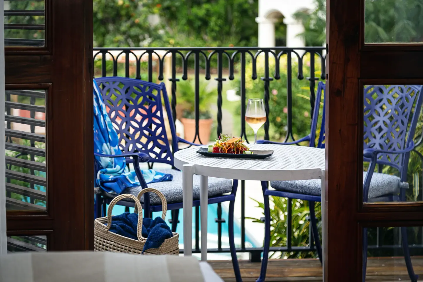 Garden View Room balcony table with chairs at Cap Maison Resort & Spa.