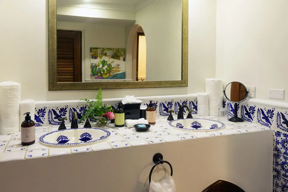 Garden View Room bathroom vanity with twin sinks at Cap Maison Resort & Spa.