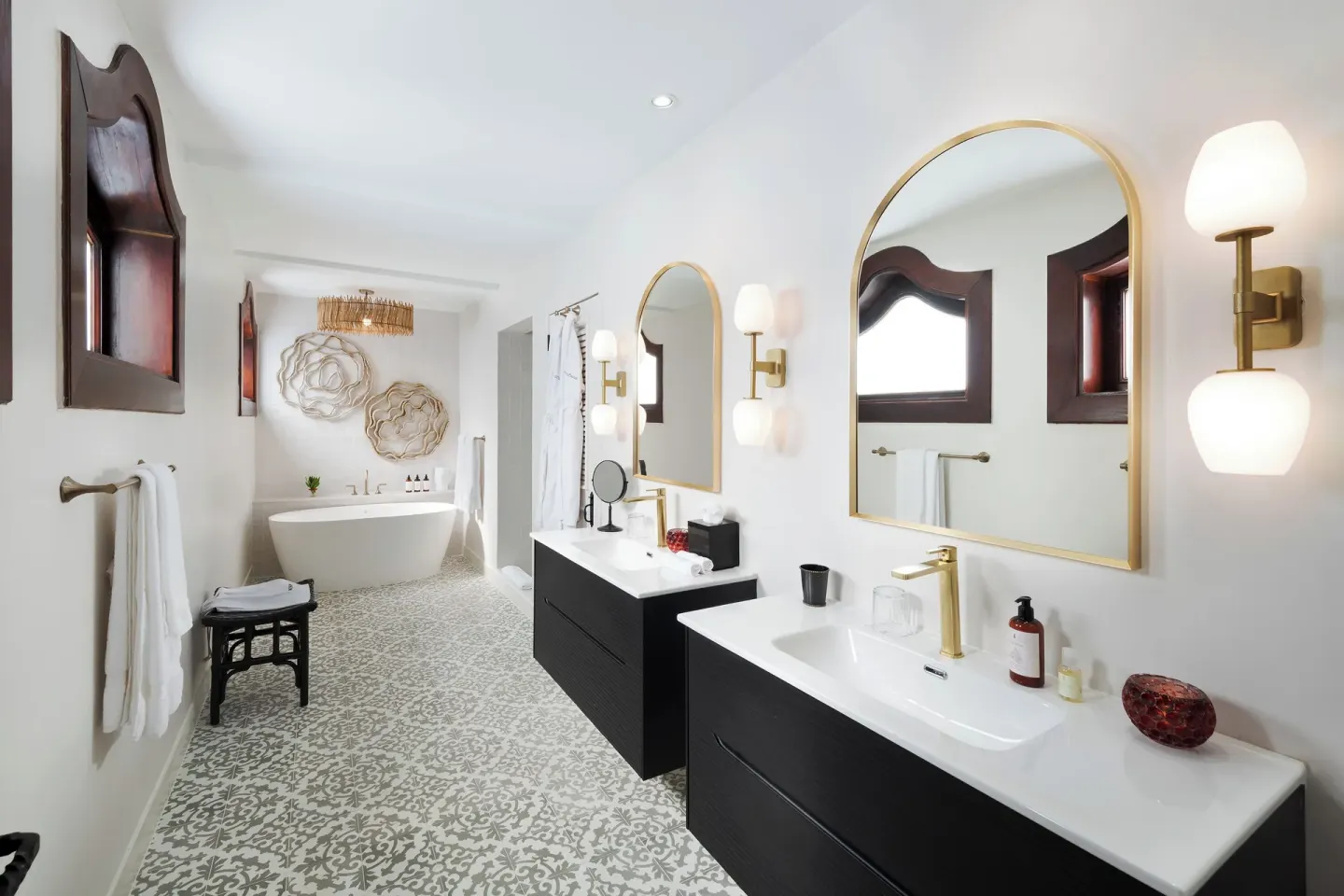 Bathroom with twin vanities and soaking tub at Cap Maison Resort & Spa.