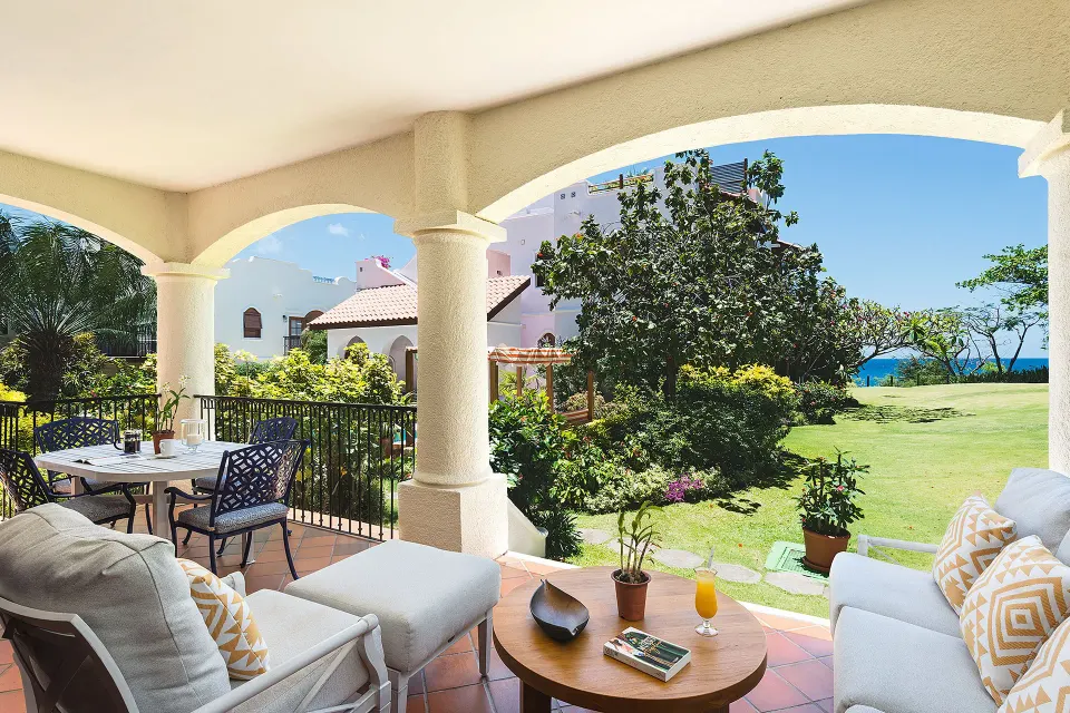 Covered terrace seating for a Spanish Courtyard suite at Cap Maison Resort & Spa.