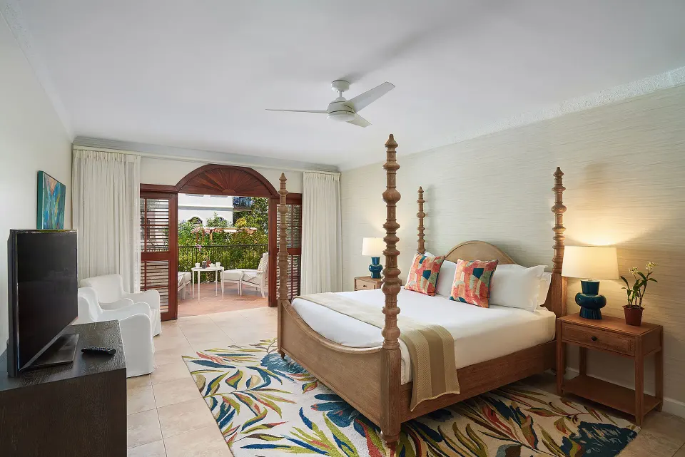 One Bedroom Spanish Courtyard suite with four-poster bed at Cap Maison Resort & Spa.
