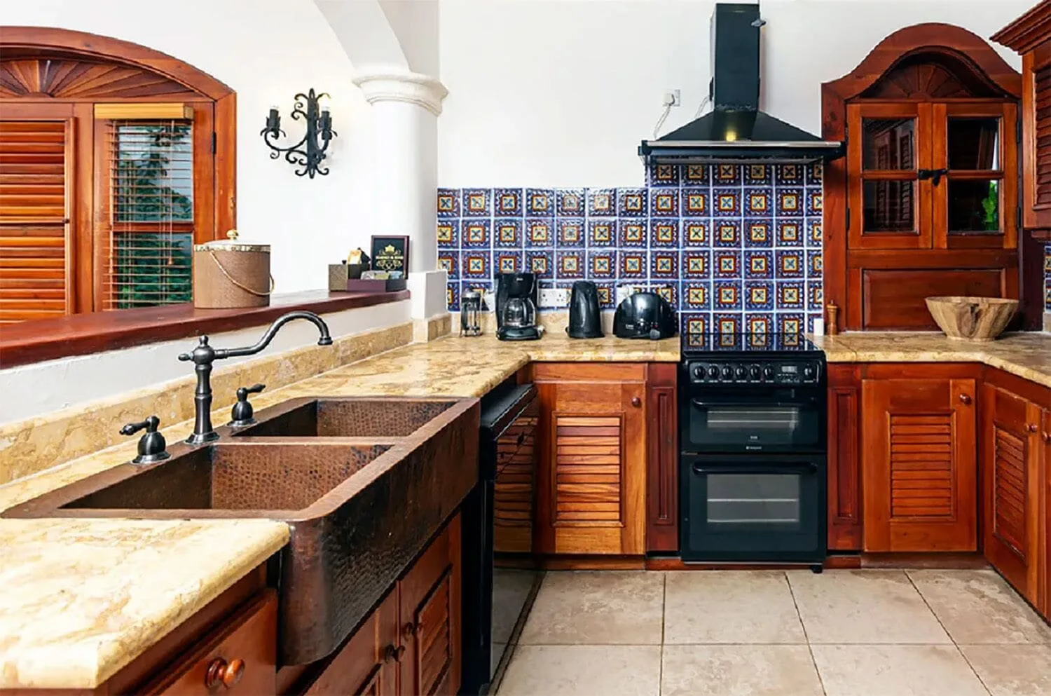 Kitchen in a One Bedroom Spanish Courtyard suite at Cap Maison Resort & Spa.