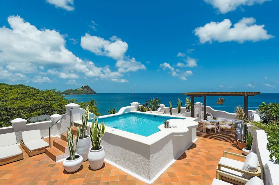 Ocean-view villa terrace with pool and loungers at Cap Maison Resort & Spa.