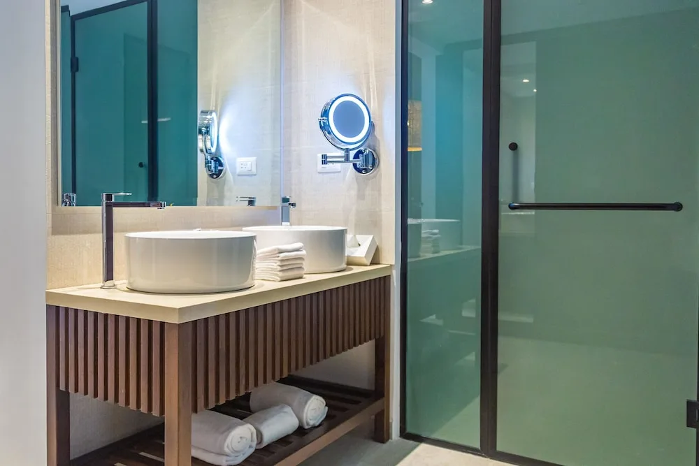 Guest bathroom vanity and frosted glass shower at Caribe Deluxe Princess.
