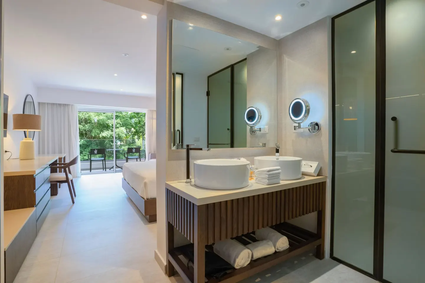 Guest room vanity with vessel sinks and shower at Caribe Deluxe Princess.