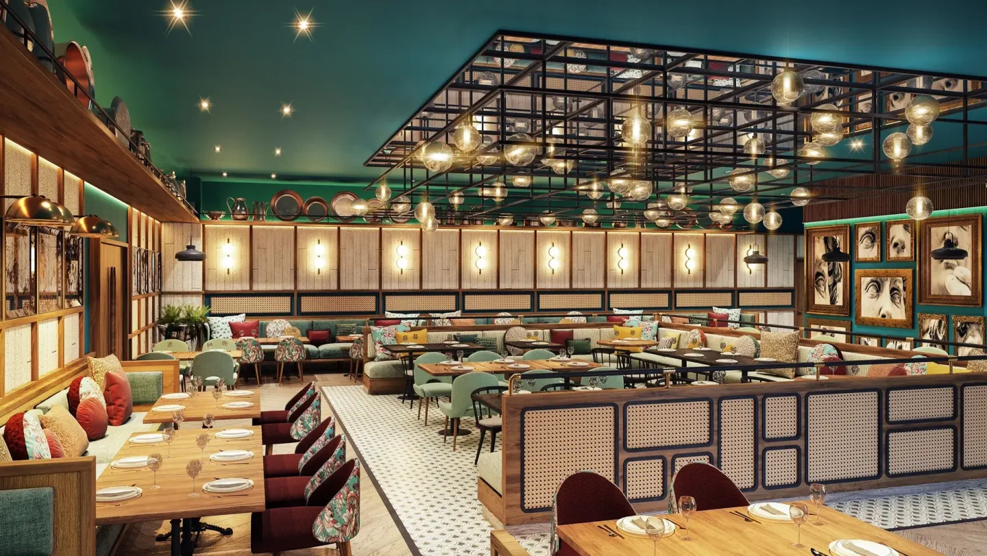 Colorful restaurant dining room with banquettes and framed wall art at Caribe Deluxe Princess.