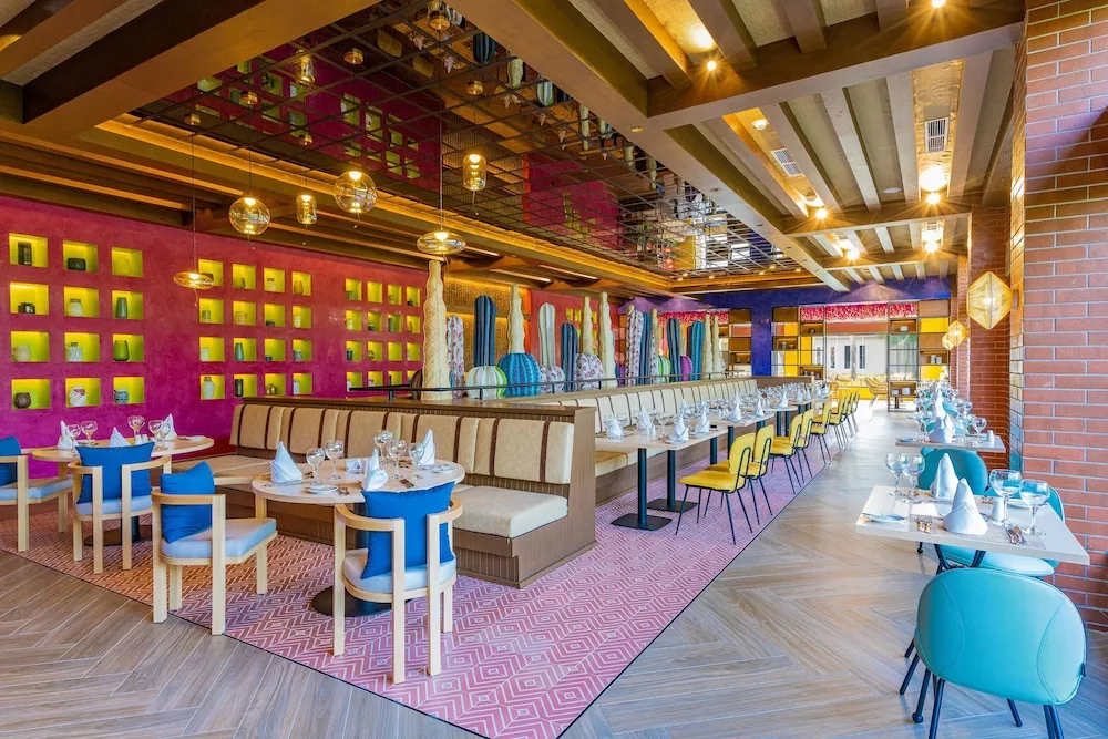 Bright Tex-Mex style dining room with cactus décor at Caribe Deluxe Princess.