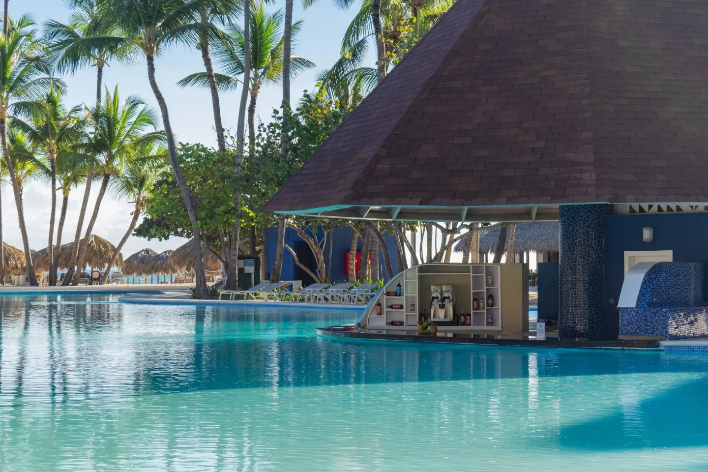 Swim-up bar under a pyramid roof beside the pool at Caribe Deluxe Princess.