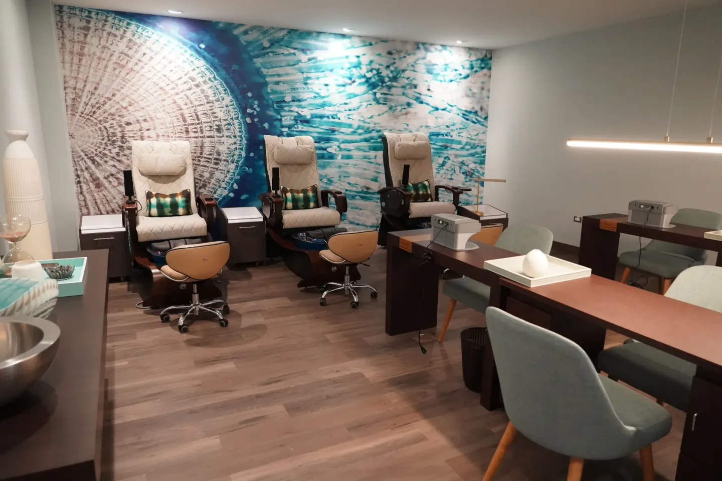 Nail salon room with pedicure chairs and manicure stations at Caribe Hilton.