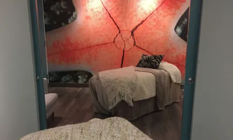 Spa treatment room with starfish wall mural at Caribe Hilton.
