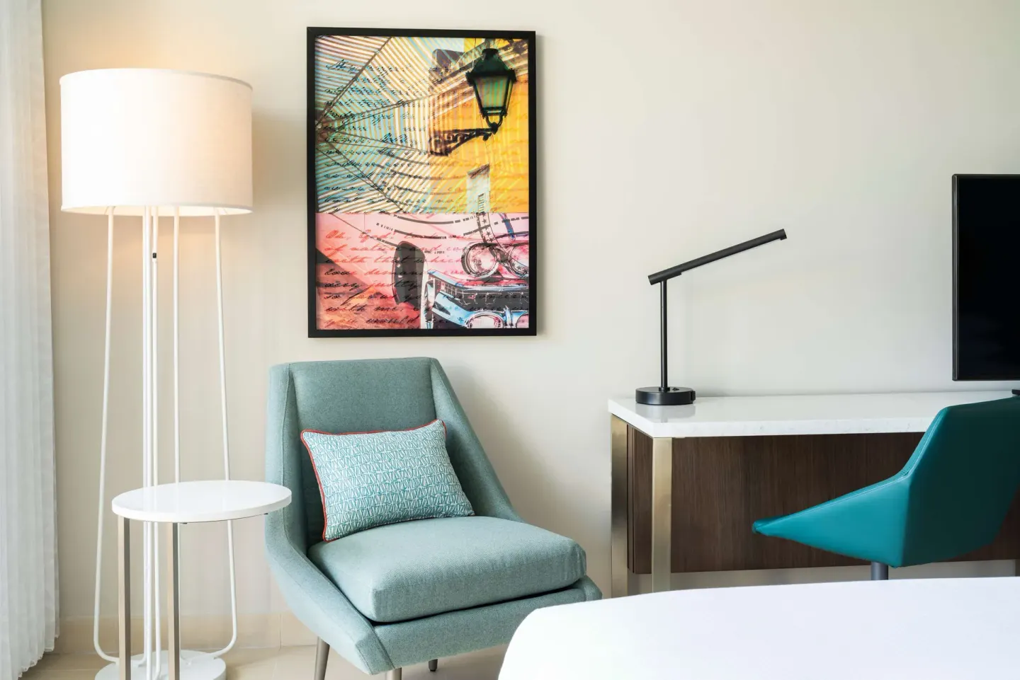 Premium Garden View king room seating and desk area at Caribe Hilton.