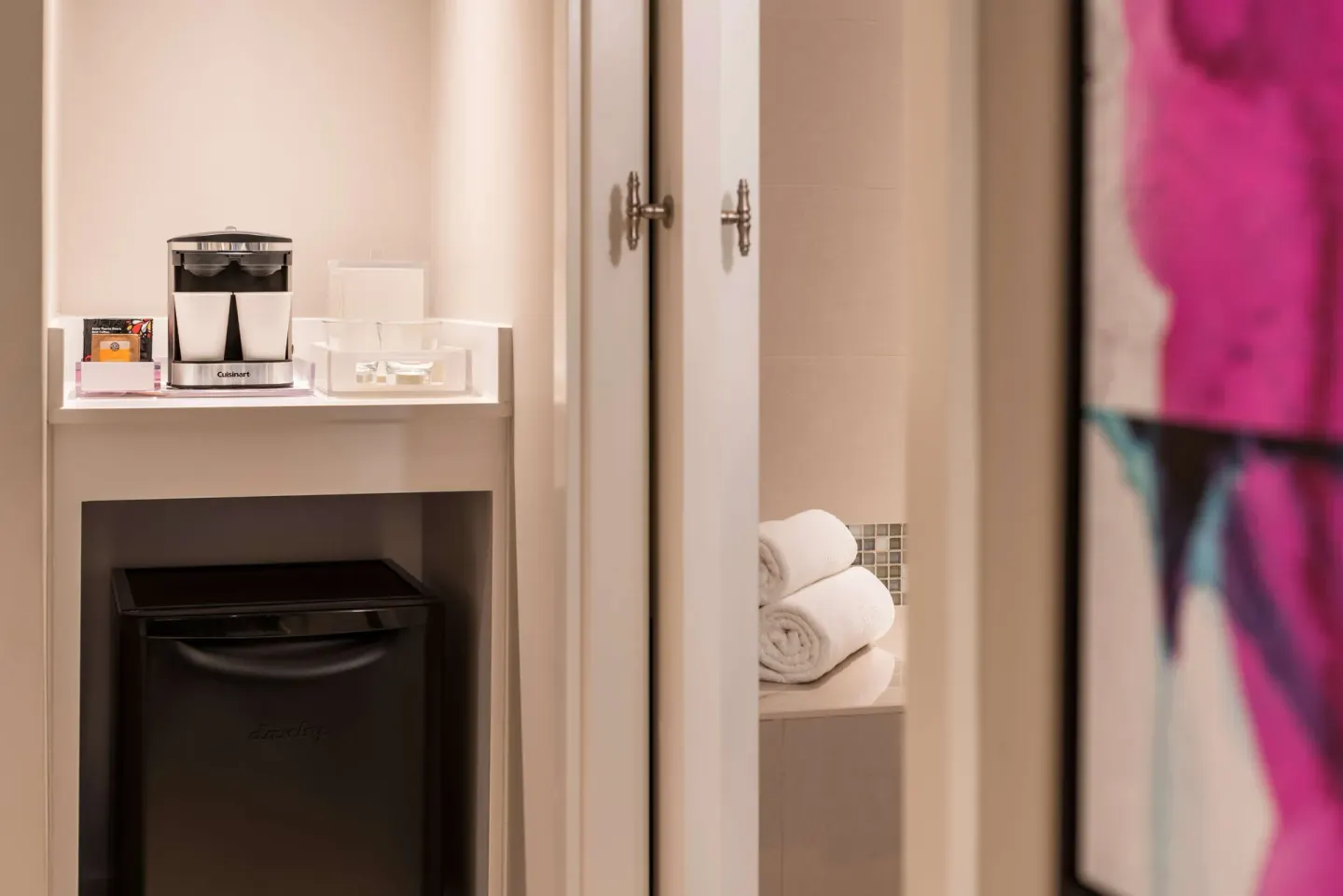 Premium Garden View room coffee nook and mini refrigerator at Caribe Hilton.