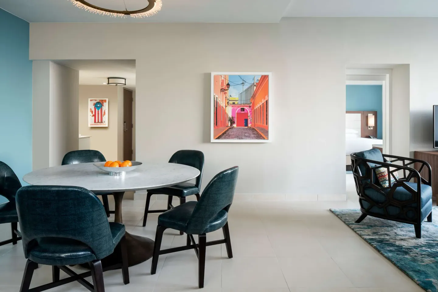Premium garden view suite dining area and adjoining king bedroom at Caribe Hilton.