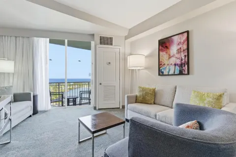 Family Connecting Junior Suite living area with balcony at Caribe Hilton.
