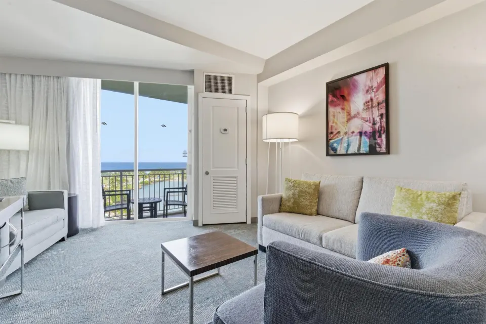 Family Connecting Junior Suite living area with balcony at Caribe Hilton.