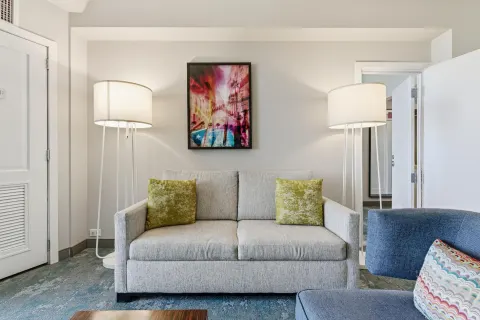 Family Connecting Junior Suite sofa and lamps at Caribe Hilton.