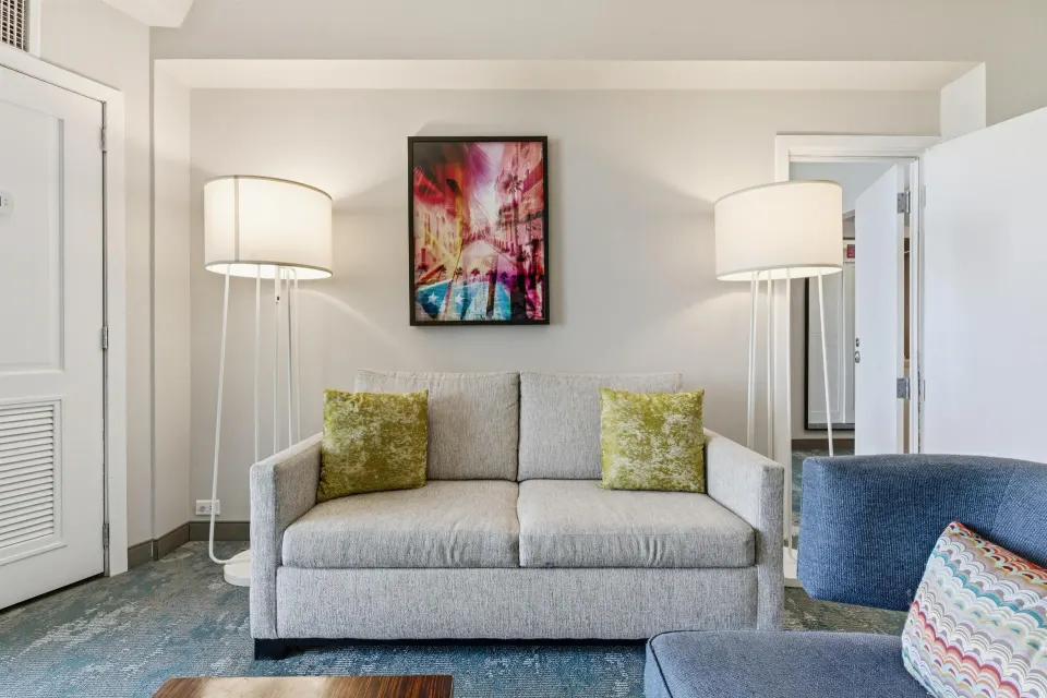 Family Connecting Junior Suite sofa and lamps at Caribe Hilton.