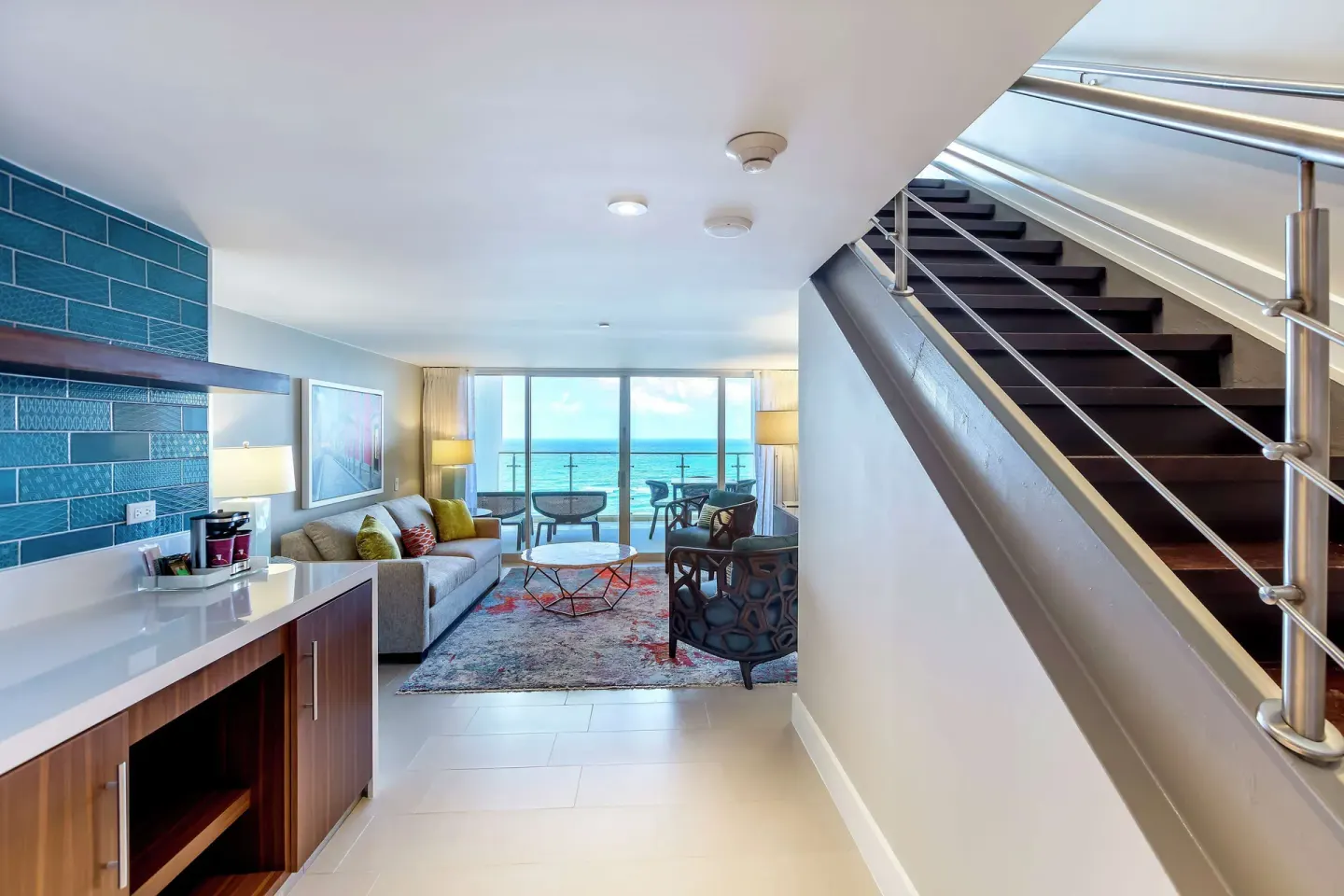 Honeymoon suite entry and ocean-facing living area at Caribe Hilton.