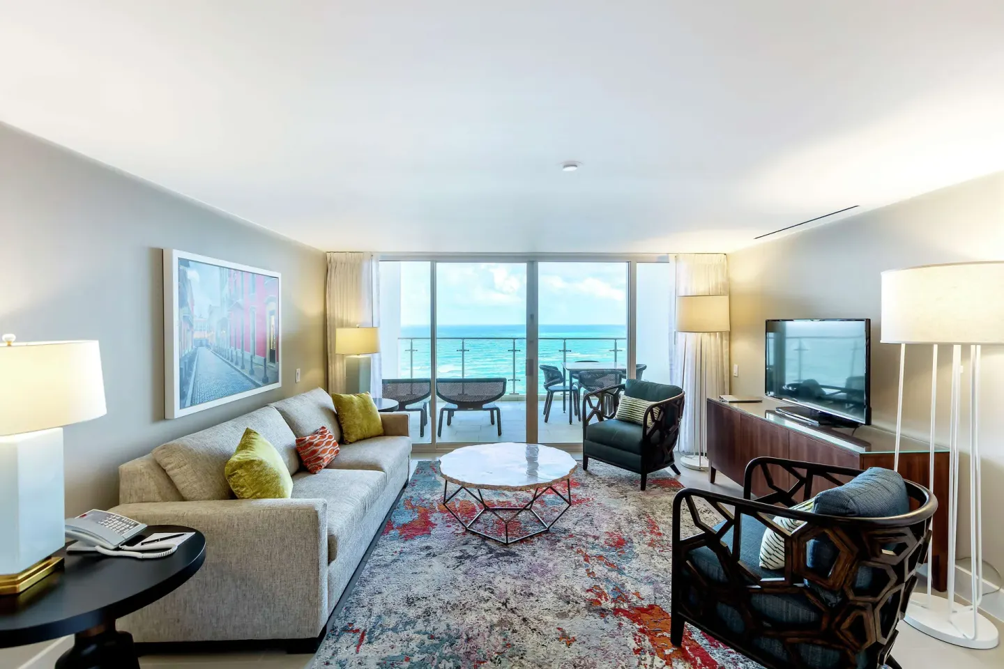 Honeymoon suite living room with balcony and ocean view at Caribe Hilton.