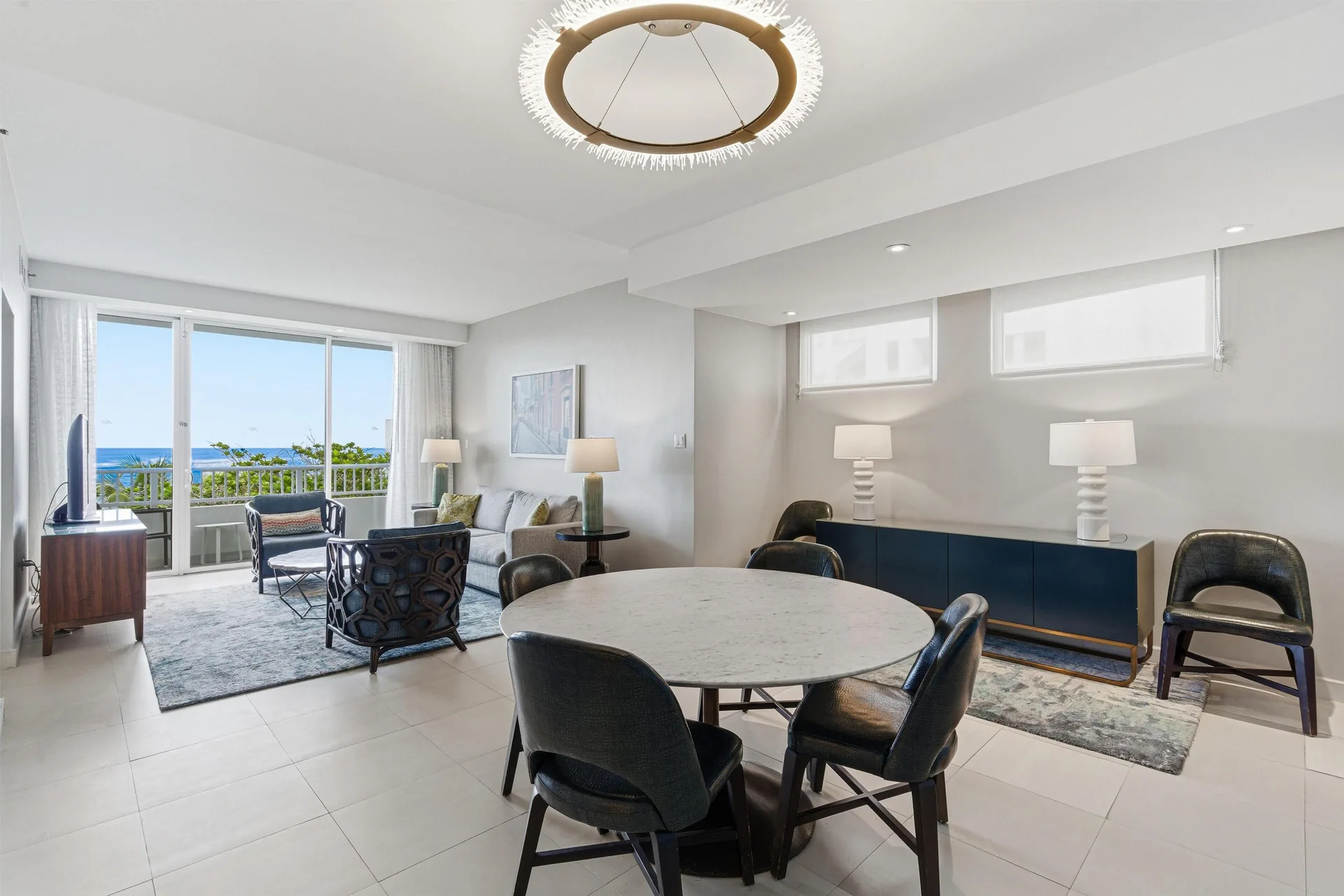Premium Suite dining and living area with balcony doors at Caribe Hilton.