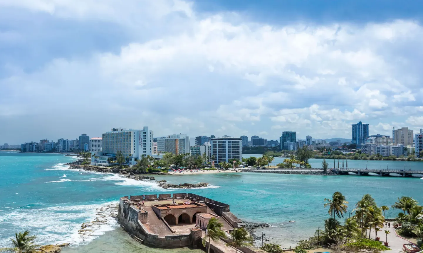 Ocean, coastline, bridge, and city skyline view from Caribe Hilton.