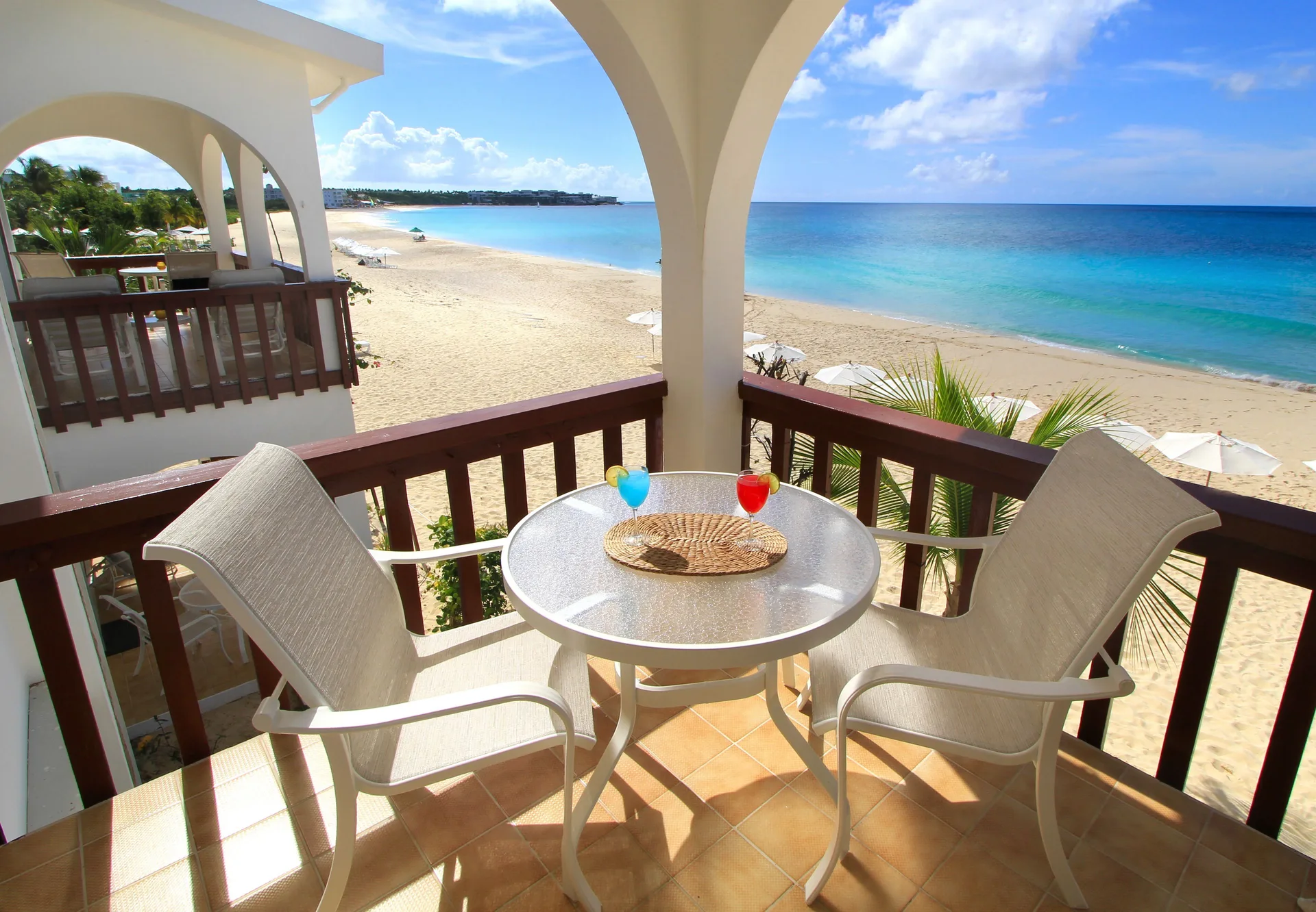 Balcony table and chairs overlooking the beach at Carimar Beach Club.