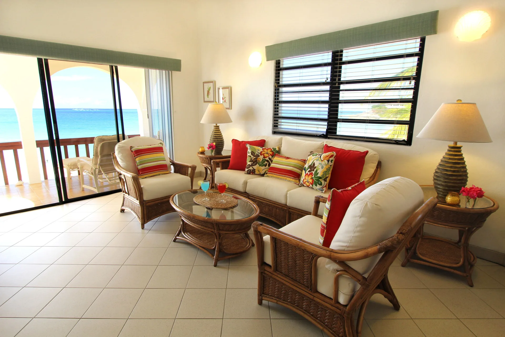 Oceanfront living room with balcony access at Carimar Beach Club.