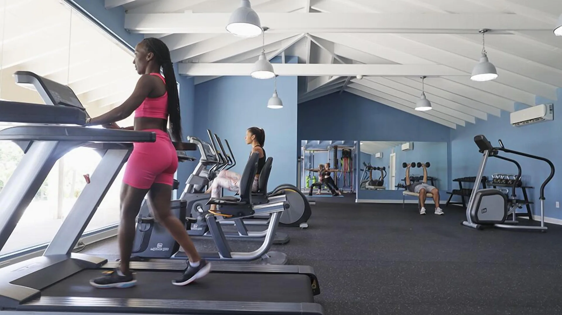 Guests using treadmills and cardio machines at Carina Bay Boutique Resort & Casino.